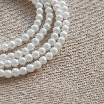 Перлини штучні 6 мм круглі білі в низці 103312 фото